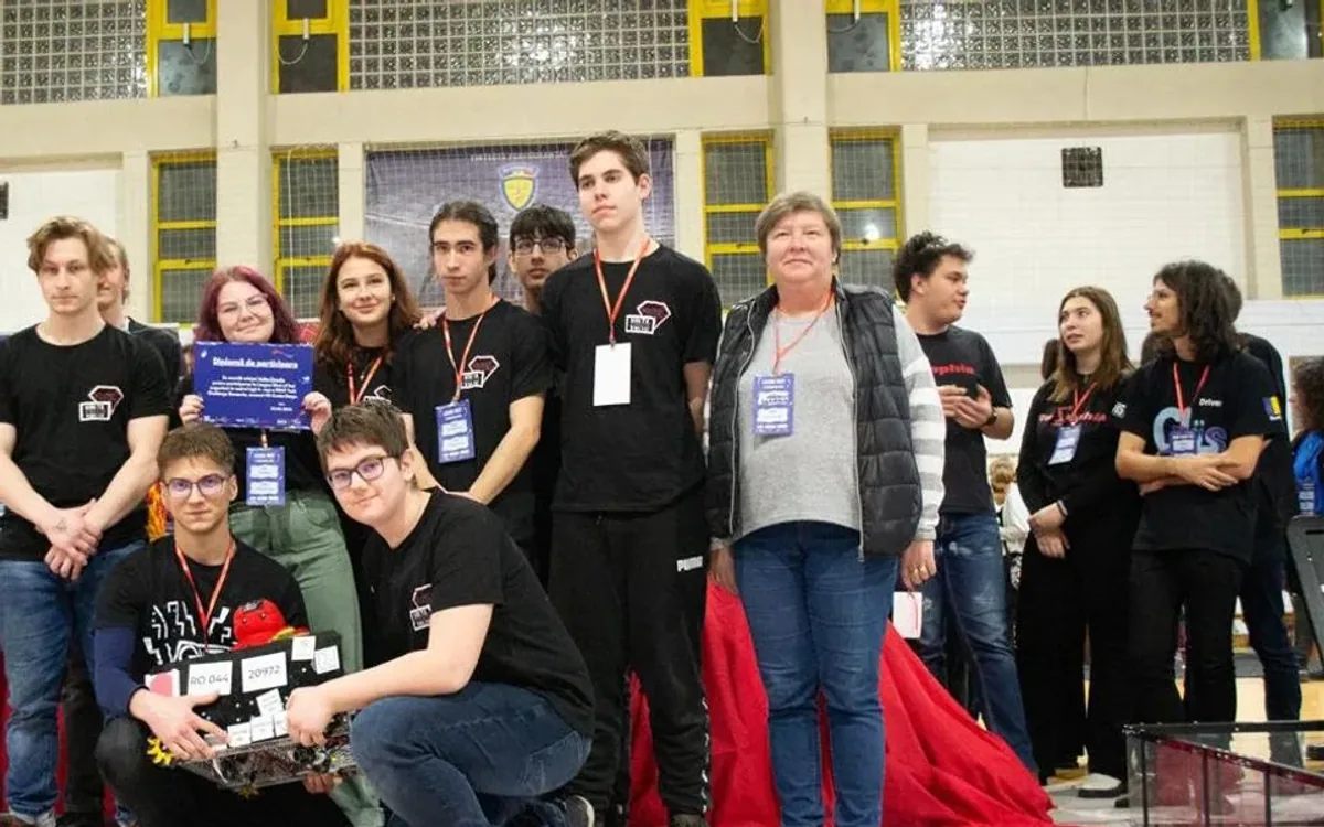 Volta Circuits with their robot and award
