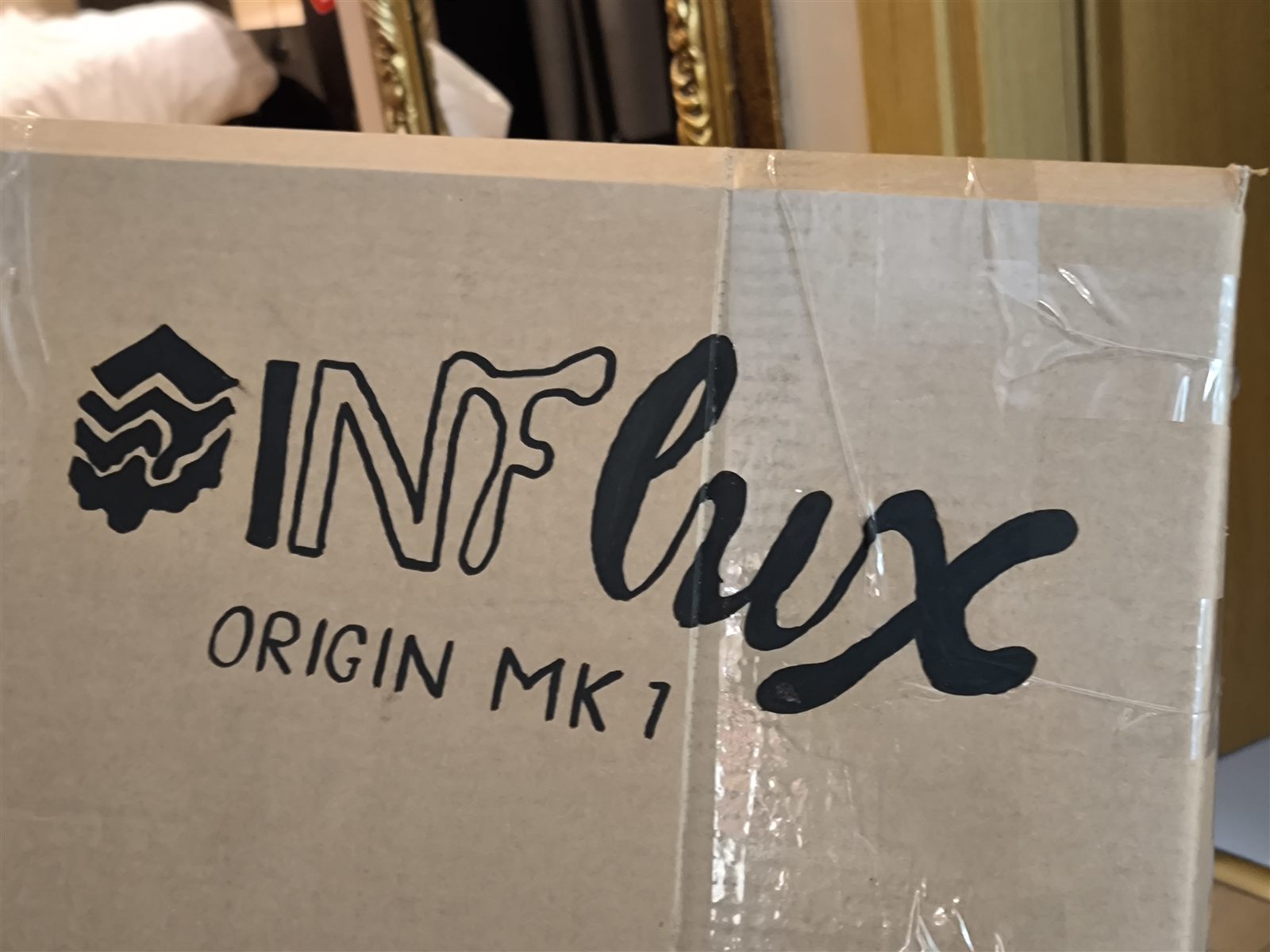 The first hand-drawn InFlux Origin MK1 logo on the cardboard prototype
